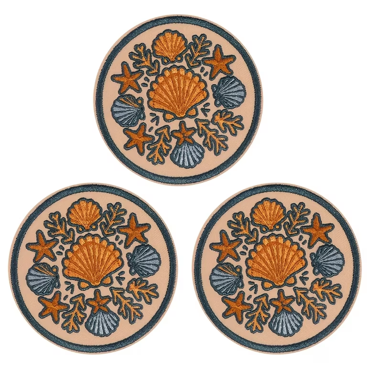 Three round coasters with an orange and blue seashell and starfish pattern on a beige background, arranged in a triangle on a white background.