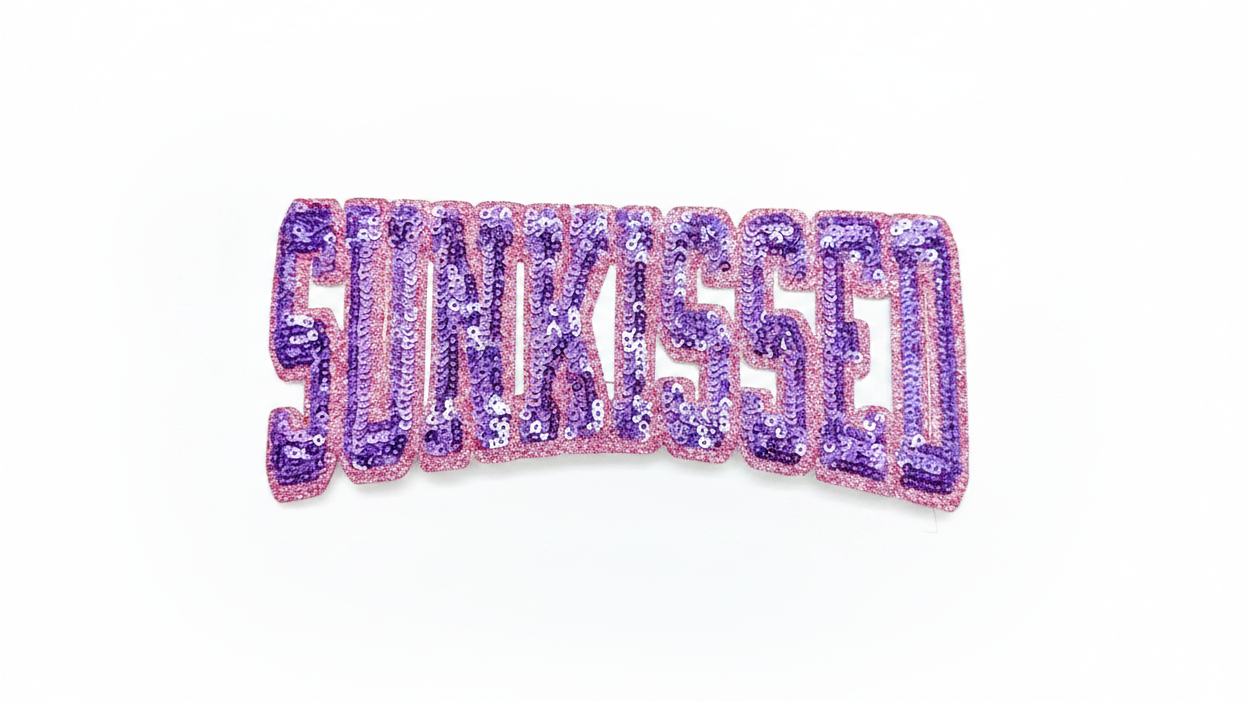  glittery purple sign with 'SUNKISSED"